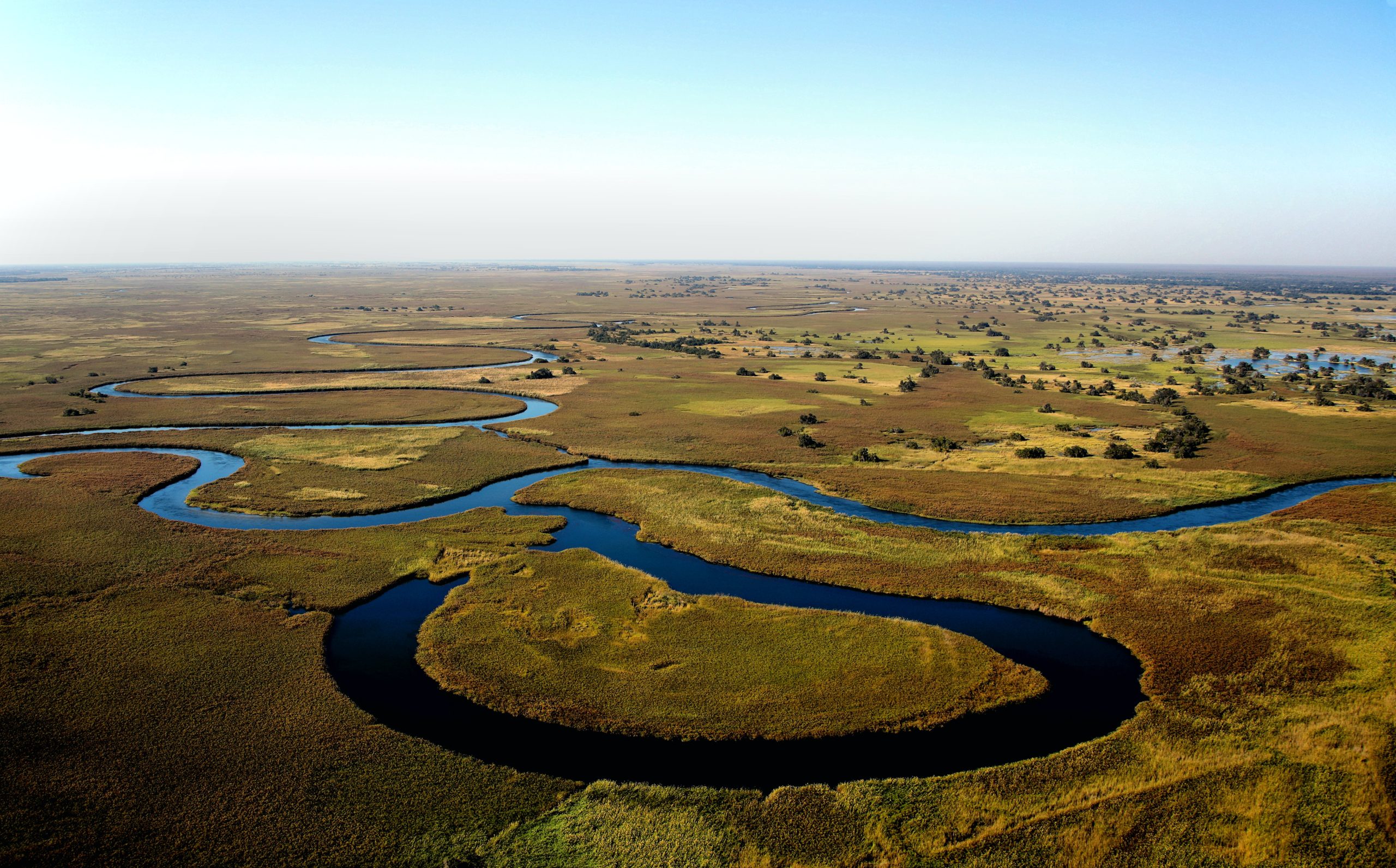 aerial view of Shakawe River snaking through Botswana plains