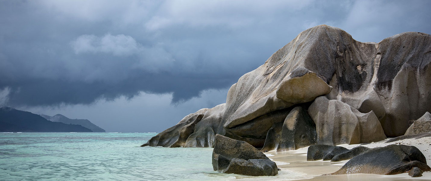 Large granite outcrop on a beach in the seychelles