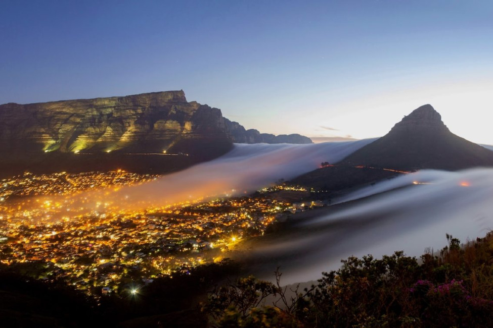 scene of cape town at night against backdrop of table mountain